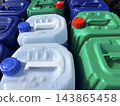 Colorful plastic canisters containing automotive fluids at a gas station. Gas station or auto parts store 143865458