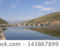 River dam and spillway among terraced hills 143867899