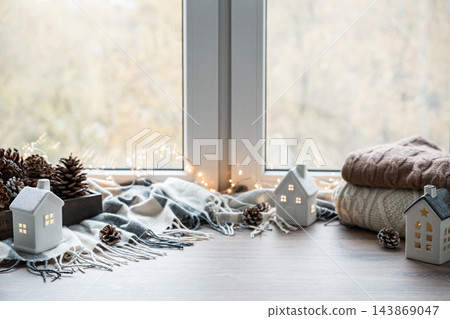 Cozy Christmas decorations with ceramic houses and copy space Cozy Christmas decorations with ceramic houses and copy space 143869047