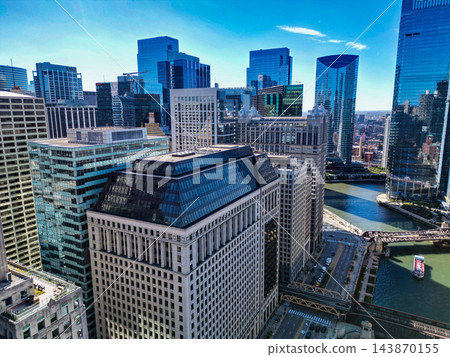 Chicago, USA - October 08, 2024: Chicago River in City. Chicago city downtown. Skyscraper modern architecture. Chicago city cityscape. Cityscape skyscraper building. Downtown architecture and river Chicago, USA - October 08, 2024: Chicago River in City. Chicago city downtown. Skyscraper modern architecture. Chicago city cityscape. Cityscape skyscraper building. Downtown architecture and river 143870155