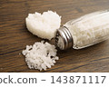 Sodium chloride sea salt with salt shaker. 143871117