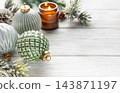 Christmas ornaments, candle and fir branches on a white wooden table 143871197