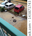 Parking lot and vehicle damage caused by muddy water and sediment in the heavy rain disaster 143871743