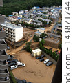Residential areas and vehicles were flooded with muddy water and sediment due to heavy rain. 143871744