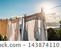 Sunlit Laundry Hanging Beside a Mountain Lake 143874110