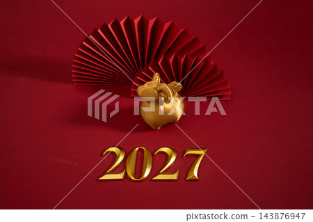 Golden ram for the 2027 lunar new year with red paper fans Golden ram for the 2027 lunar new year with red paper fans 143876947