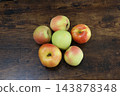 Apple against a wooden background 143878348