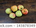 Apple against a wooden background 143878349