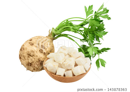 diced celery root in wooden bowl isolated on white background diced celery root in wooden bowl isolated on white background 143878363