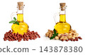peanut oil in a glass bottle with peanuts 143878380