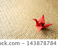 Japanese-style background material featuring origami cranes and bamboo mats. 143878784