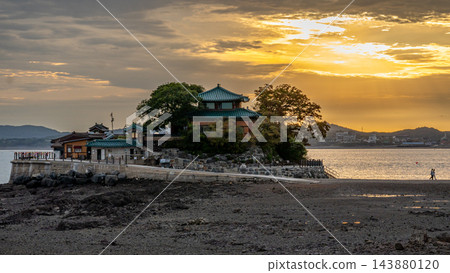Ganwolam Temple by the Sea at Golden Sunset Ganwolam Temple by the Sea at Golden Sunset 143880120