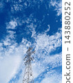 A transmission tower in the early autumn sky 143880252