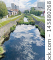 Autumn blue sky reflected in the stream 143880268