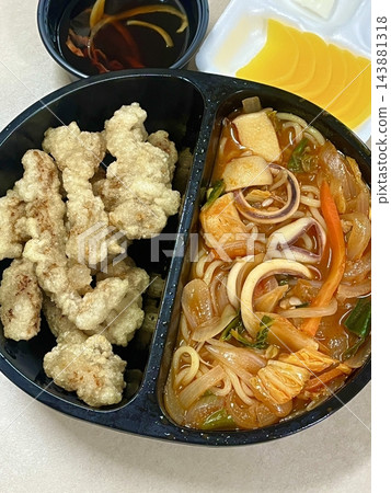A classic Korean-Chinese combo of jajangmyeon with thick, chewy noodles coated in rich black bean sauce, served alongside crispy tangsuyuk, deep-fried pork with sweet and sour sauce. 143881318