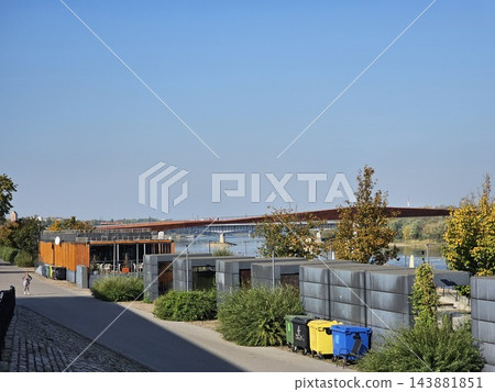 Warsaw, Poland - October 7, 2026: Landscaped Vistula Waterfront With Trees and Low Buildings 143881851
