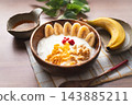 Image of a banana and yogurt breakfast 143885211