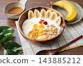 Banana, yogurt, and granola 143885212