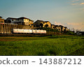 Nishitetsu 600 series two-tone color shining in the setting sun 143887212