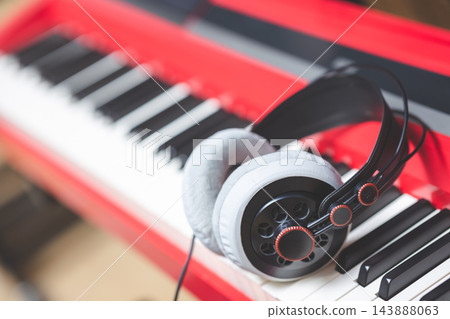 headphone on piano keys. music background headphone on piano keys. music background 143888063
