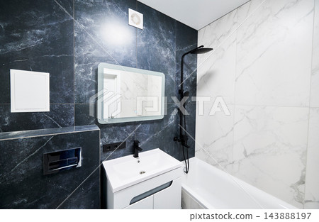 Modern bathroom interior with sink vanity, bathtub and black shower set Modern bathroom interior with sink vanity, bathtub and black shower set 143888197