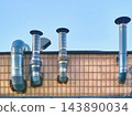 Ventilation metalic pipes for airflow.Chimney tiles roof 143890034
