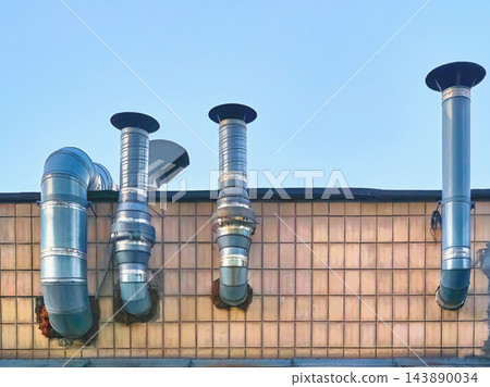 Ventilation metalic pipes for airflow.Chimney tiles roof Ventilation metalic pipes for airflow.Chimney tiles roof 143890034