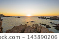 Aerial sunset above granite sea stacks at Costa Paradiso Sardinia 143890206