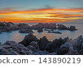Colorful sunset over rugged granite coast at Costa Paradiso 143890219