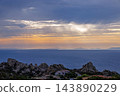 Dramatic sunbeams above the Mediterranean Sea in Sardinia 143890229