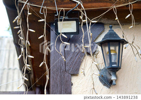 Set of decorative street lighting.String lights,vintage lantern,floodlights. Set of decorative street lighting.String lights,vintage lantern,floodlights. 143891238