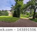 The Temple of Friendship and a small bridge amidst the greenery of Pavlovsk Park in summer. Pavlovsk. Saint Petersburg. Russia. 143891506
