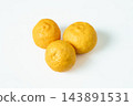 Three yuzu fruits photographed against a white background. 143891531
