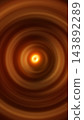 Abstract orange vortex with glowing concentric rings, bright central core, and warm swirling energy motion. 143892289