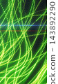 Glowing green and yellow particle strands weave across a dark background, forming flowing curves with radiant highlights. 143892290