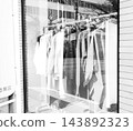 Clothes hanging 143892323