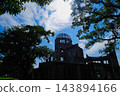 The Atomic Bomb Dome stands beneath a blue sky and white clouds. 143894166