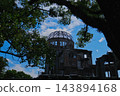 The Atomic Bomb Dome surrounded by trees and the blue sky 143894168