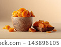 Organic dried apricots in wooden bowl on  a beige background. 143896105