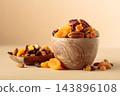 Assorted nuts and dried fruits in wooden bowl on  a beige background. 143896108