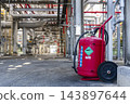 Large mobile powder fire extinguisher and complex piping system in an industrial plant facility 143897644