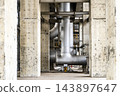 Large metallic piping and pipeline system of an industrial plant framed between massive concrete pillars 143897647