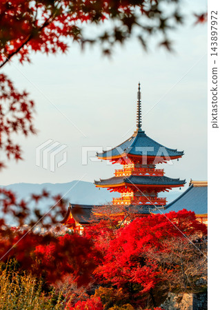 Kiyomizu-dera temple pagoda with red maple leaf frame in fall, Kyoto Kiyomizu-dera temple pagoda with red maple leaf frame in fall, Kyoto 143897972