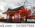 Kiyomiz-dera Sammon gate by red maple leaf at sunset in autumn, Kyoto 143897988