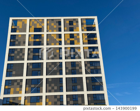 Modern Residential Apartment Building with Geometric Facade Modern Residential Apartment Building with Geometric Facade 143900199