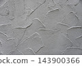 Gray plaster wall texture with troweled swirls for architectural background 143900366