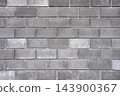 Concrete block wall forms an industrial background texture for construction and architecture 143900367