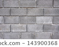Concrete block wall forms an industrial background texture for construction and architecture 143900368