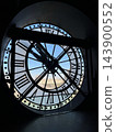 Iconic giant clock inside Musee d Orsay in Paris with Roman numerals and a view of the city through the transparent clock face. High quality photo 143900552