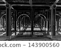 Pont de Bir Hakeim bridge in Paris with steel arches and architectural details, captured as a black and white artistic photograph. High quality photo 143900560